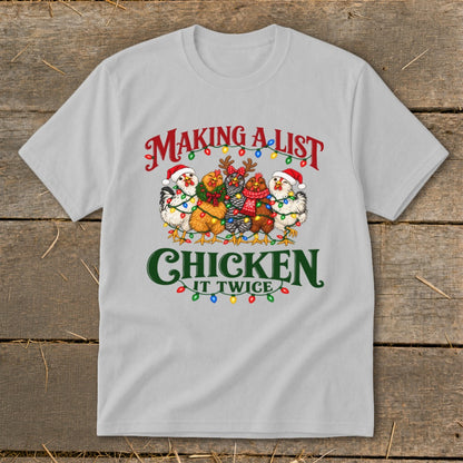 Five chickens in Santa hats and scarves with Christmas lights. Text: Making a list, chicken it twice.