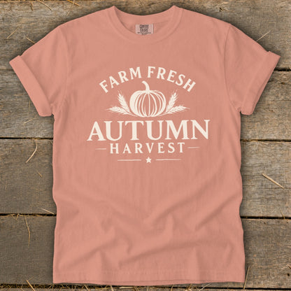 Peach t-shirt with "Farm Fresh Autumn Harvest" graphic and pumpkin design.
