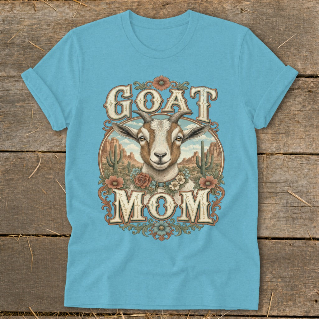 Blue t-shirt with "GOAT MOM" text and a goat in a desert landscape.