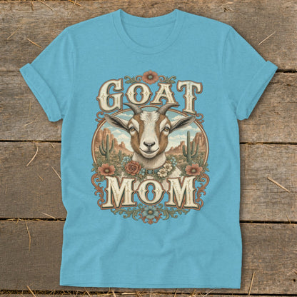 Blue t-shirt with "GOAT MOM" text and a goat in a desert landscape.
