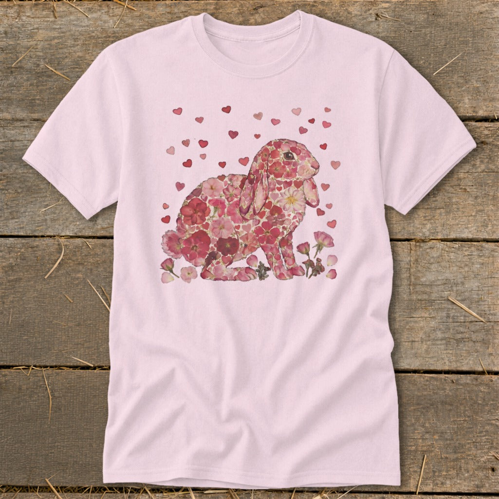 Pink t-shirt with floral bunny and scattered hearts graphic.