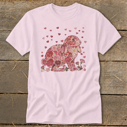 Pink t-shirt with floral bunny and scattered hearts graphic.