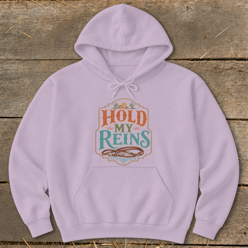 Light purple hoodie with "Hold My Reins" text and a cowboy horse bridle.