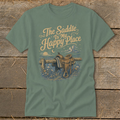 T-shirt graphic: "The Saddle Is My Happy Place" with a saddle on a fence.