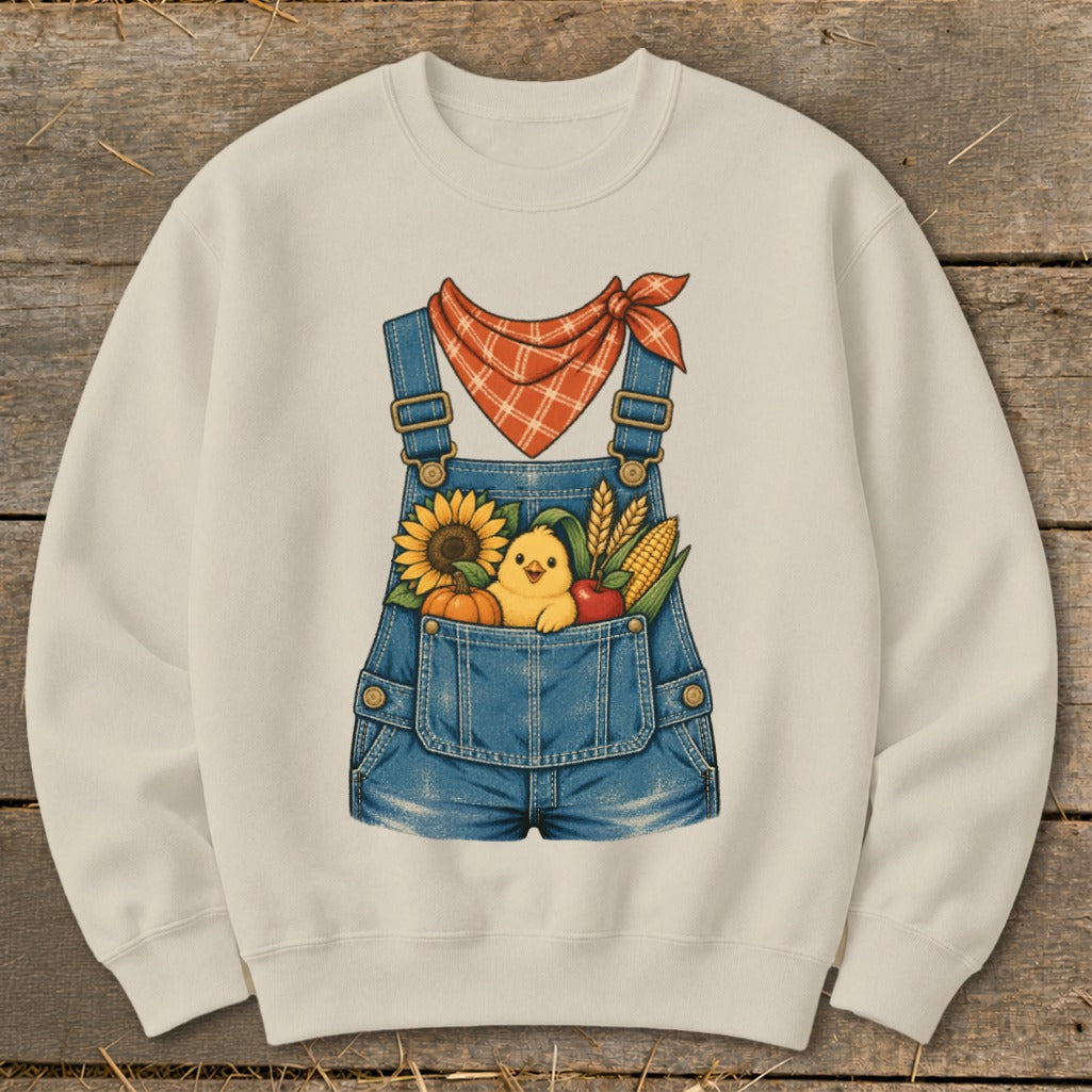 Sweatshirt with denim overalls graphic, featuring a chick, sunflower, pumpkin, apple, corn, and wheat.
