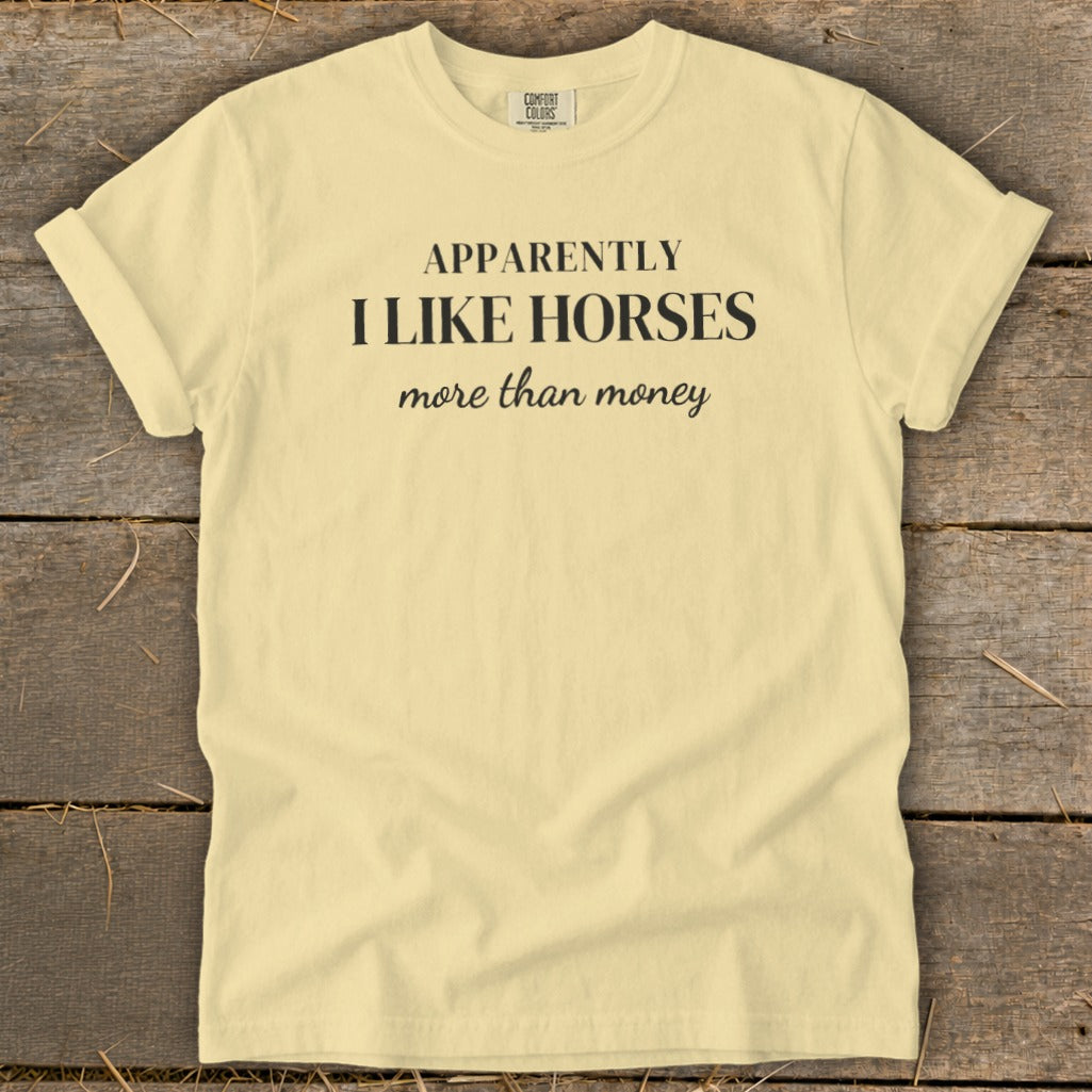Yellow t-shirt with text "APPARENTLY I LIKE HORSES more than money."