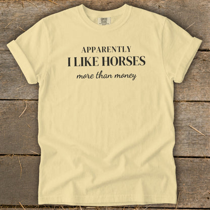 Yellow t-shirt with text "APPARENTLY I LIKE HORSES more than money."