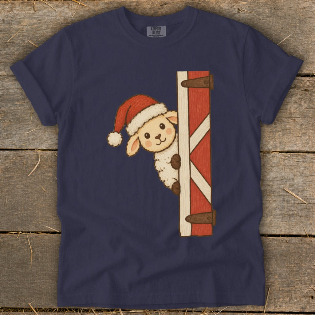Sheep wearing Santa hat peeking from behind a red barn door.
