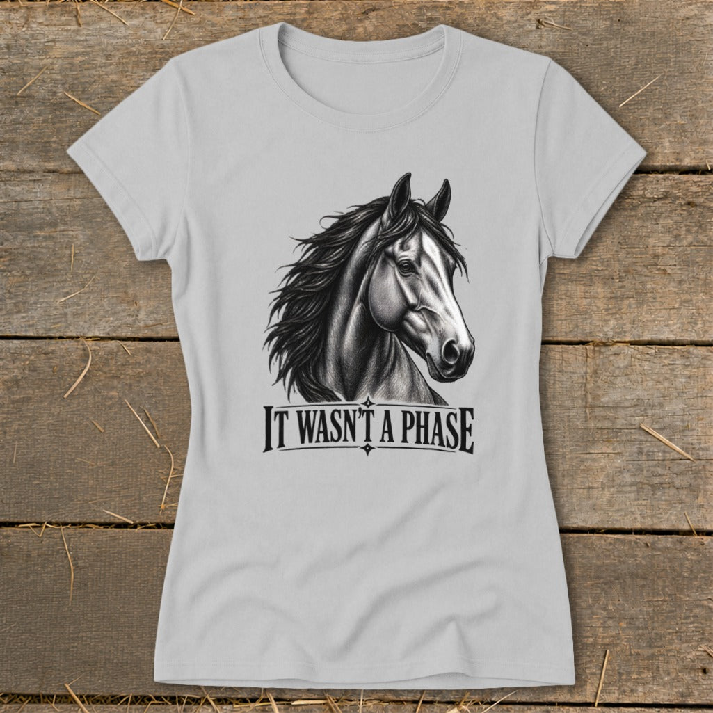 Light grey t-shirt with a charcoal drawing of a horse and text "IT WASN'T A PHASE".
