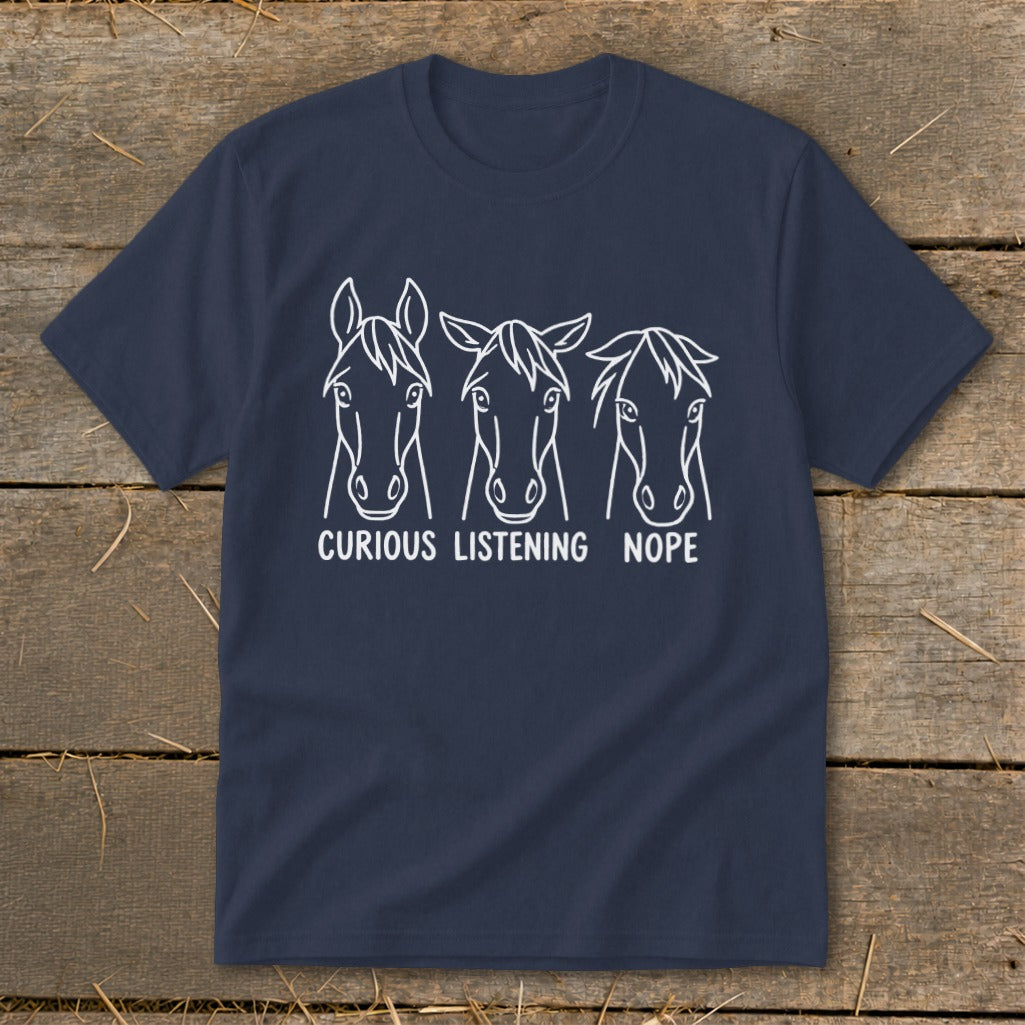 Navy blue short-sleeve t-shirt with a white line art graphic of three horses, labeled Curious, Listening, and Nope.
