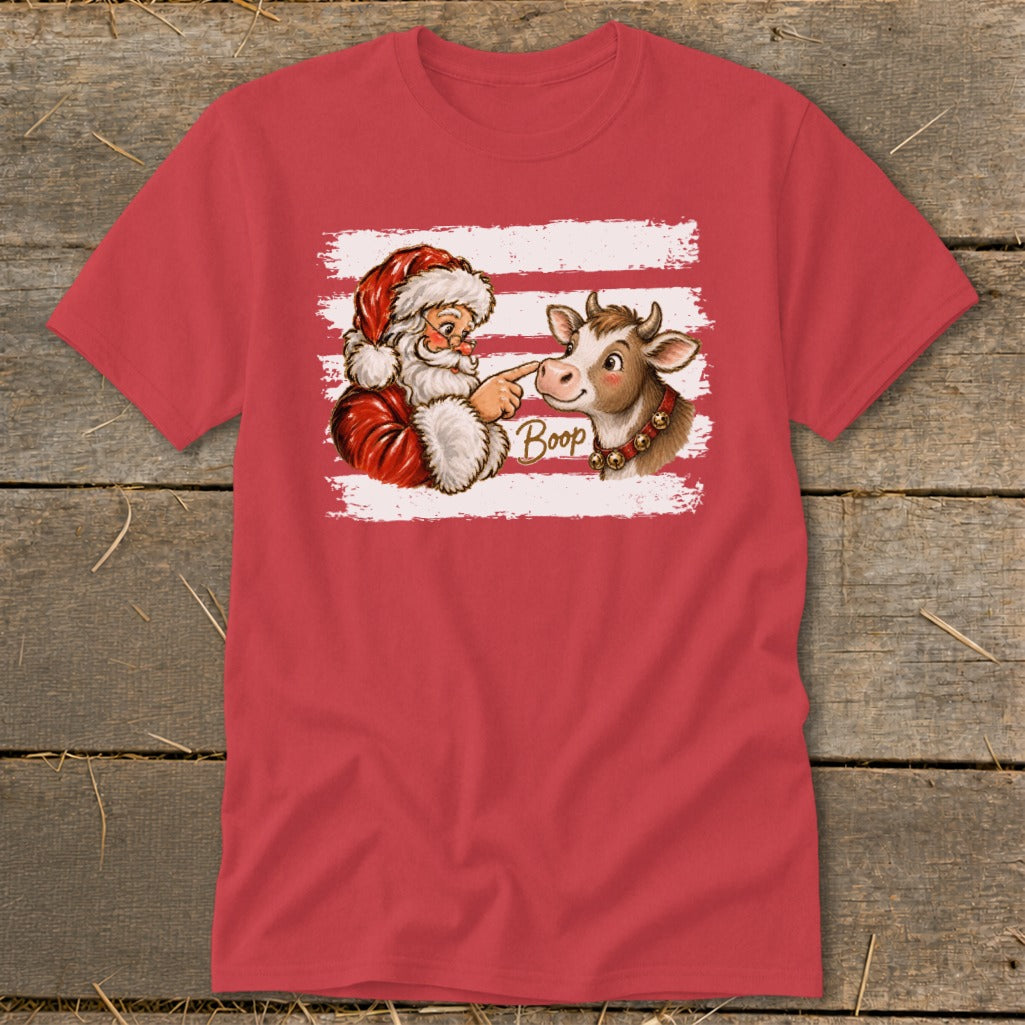 Santa booping a cow with the word "Boop" printed on a red t-shirt.