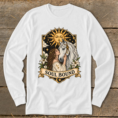 Woman with brown hair embraces a white horse under a sun with a face.