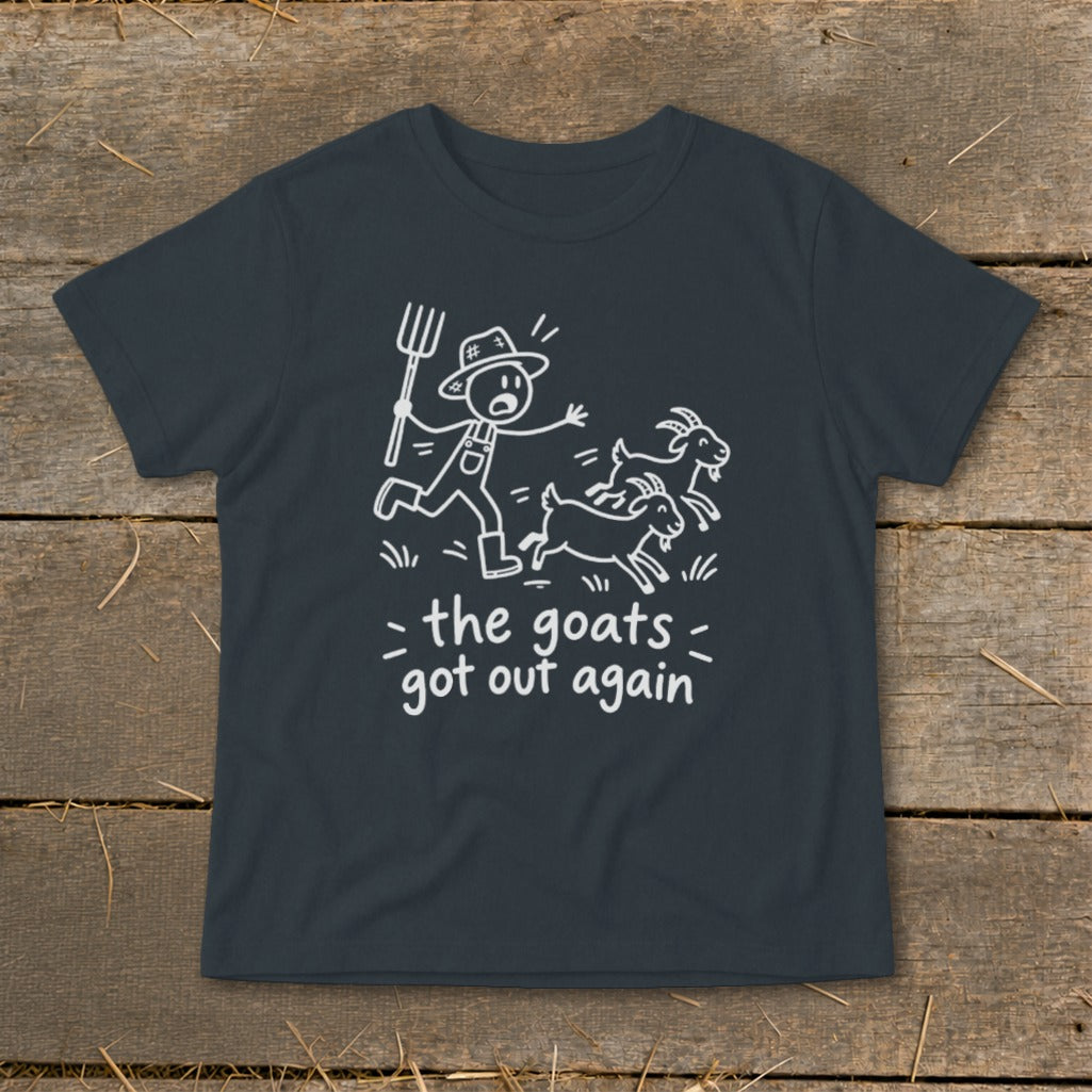Dark t-shirt with a graphic of a farmer chasing goats and text "the goats got out again".