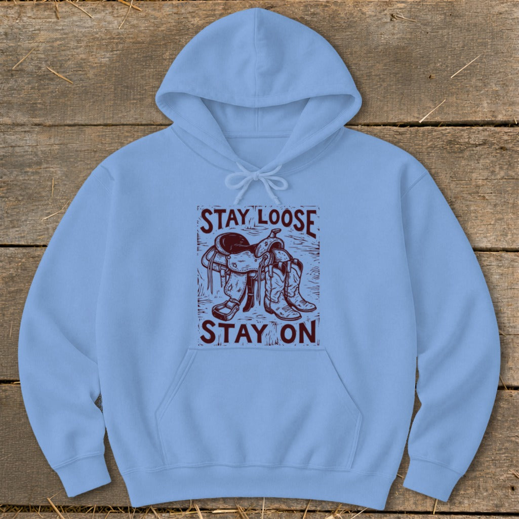 Light blue hoodie with "STAY LOOSE STAY ON" text and saddle graphic.