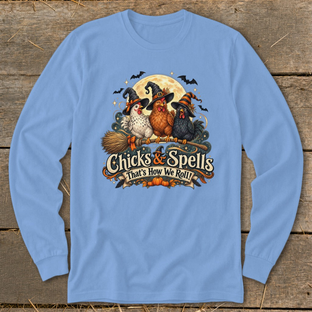 Three Halloween-themed chickens wear witch hats and ride a broomstick with text "Chicks & Spells".
