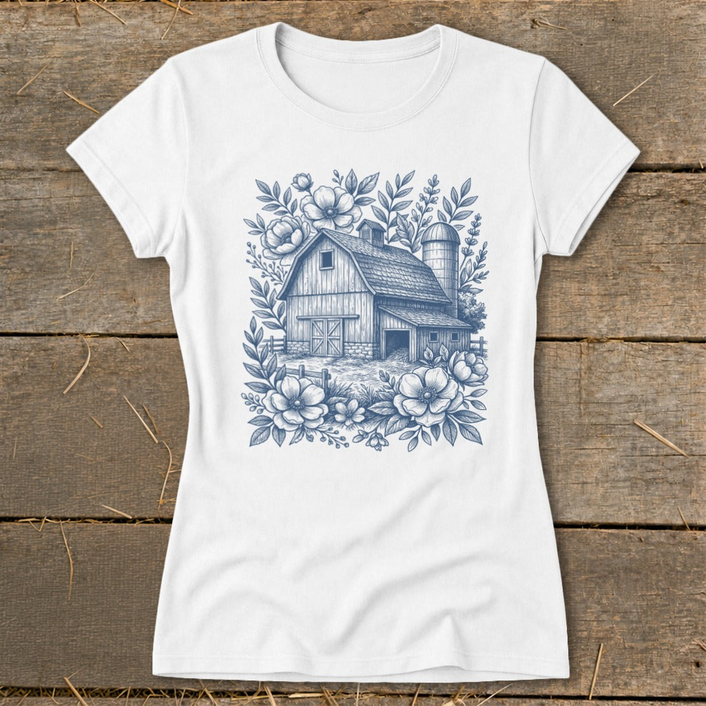 White t-shirt with a blue line drawing of a barn, silo, and flowers.