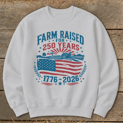 White sweatshirt with "Farm Raised for 250 Years" and "1776-2026" graphics.
