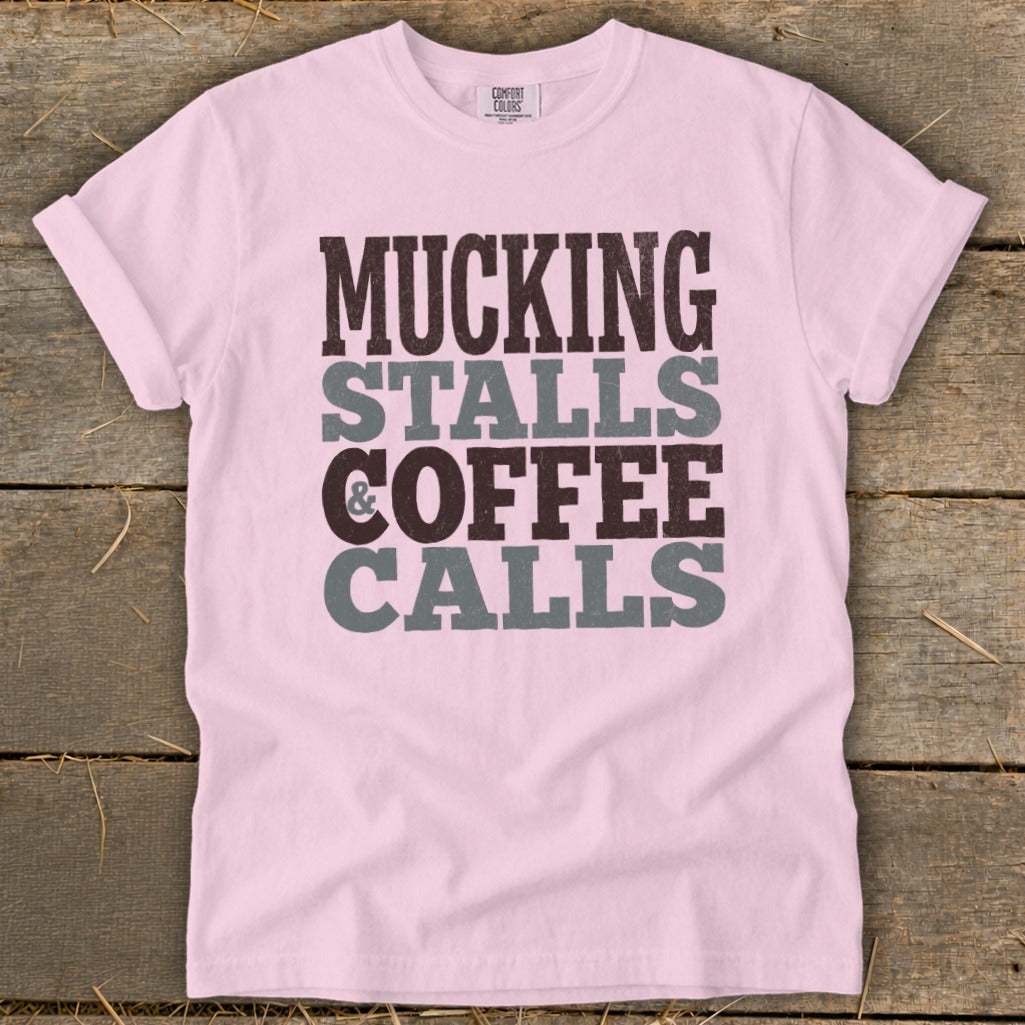Pink t-shirt with "Mucking Stalls & Coffee Calls" text.