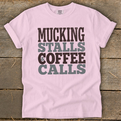 Pink t-shirt with "Mucking Stalls & Coffee Calls" text.