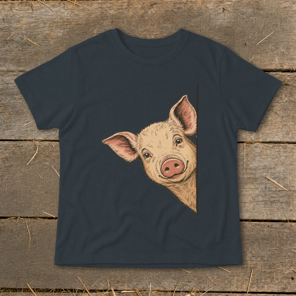 T-shirt with a peeking pig illustration on a dark background.