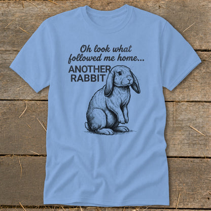 Light blue t-shirt with sketch of rabbit and text "Oh look what followed me home... ANOTHER RABBIT".