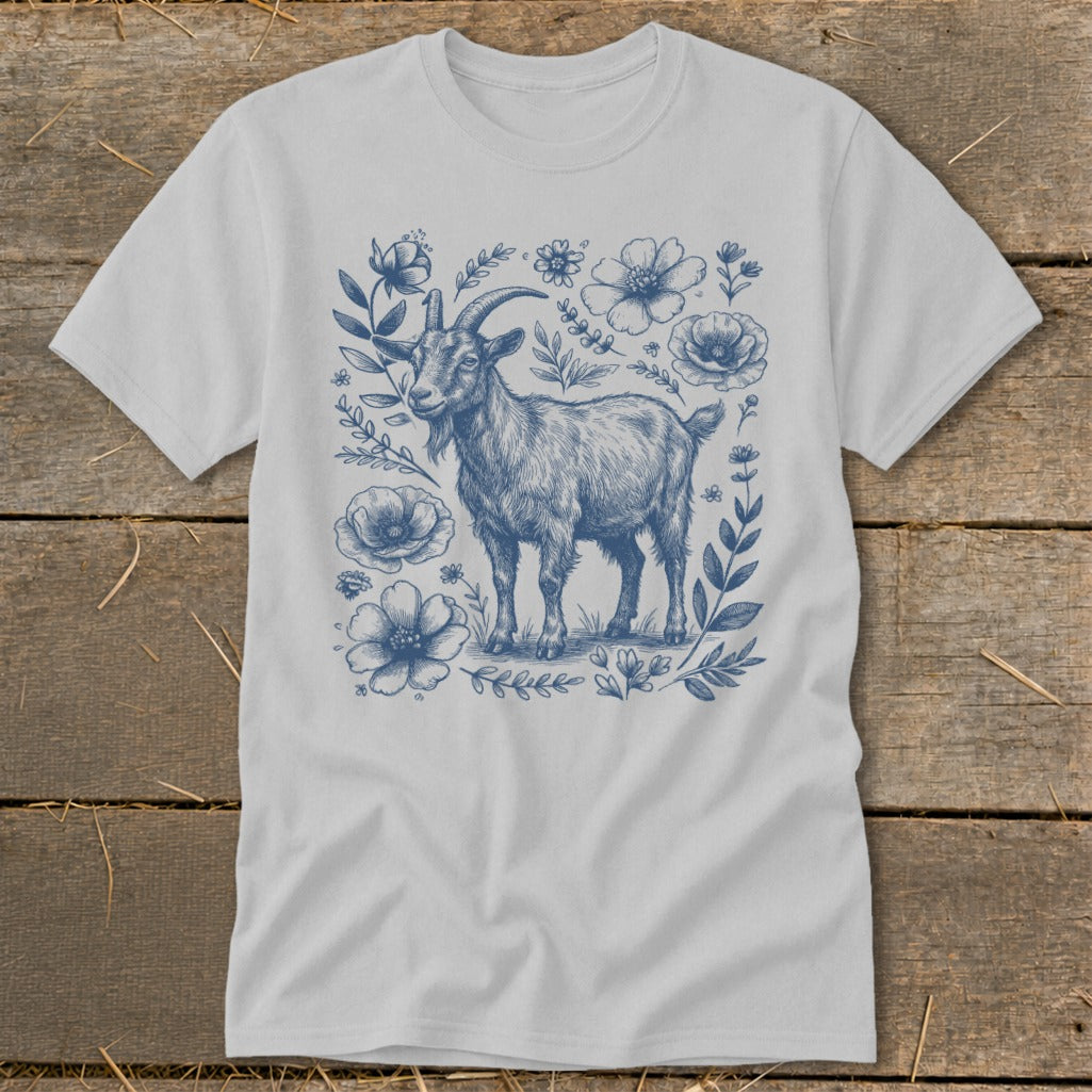 Light grey t-shirt with a blue line drawing of a goat surrounded by flowers.