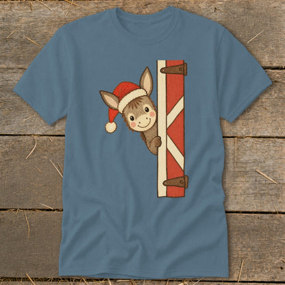 Cartoon donkey wearing Santa hat peeking from behind a barn door.