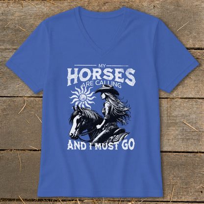 Blue t-shirt with "My Horses Are Calling And I Must Go" text and horse rider graphic.