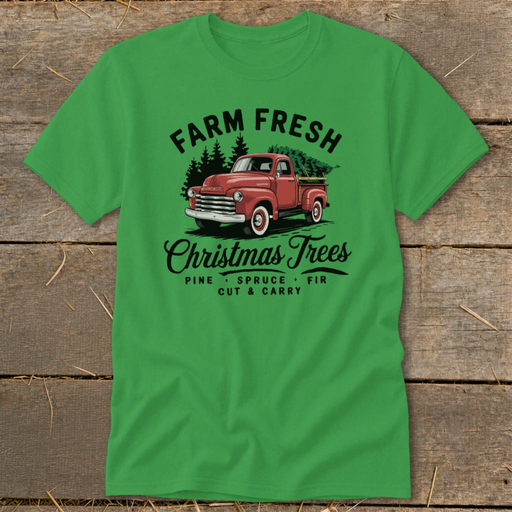 Green t-shirt with vintage red truck and Christmas trees, "Farm Fresh Christmas Trees" text.