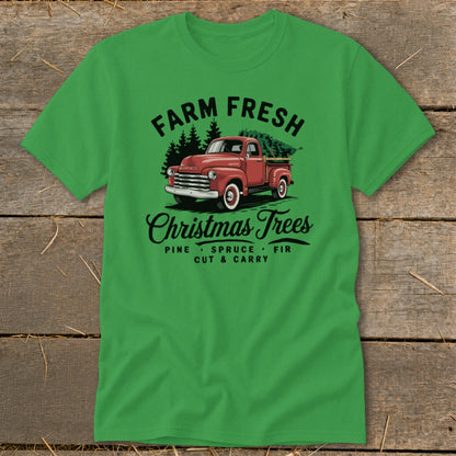 Green t-shirt with vintage red truck and Christmas trees, "Farm Fresh Christmas Trees" text.
