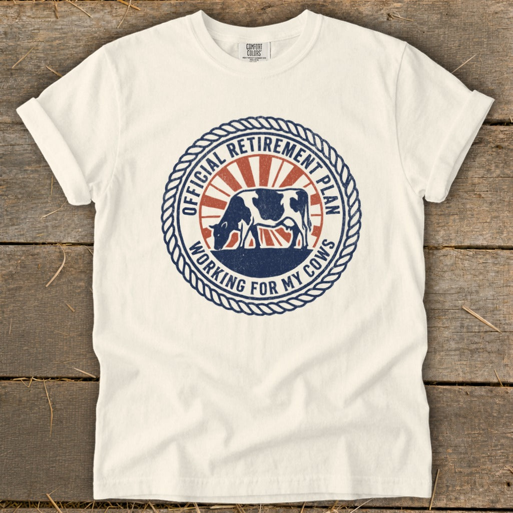 White t-shirt with circular graphic: "Official Retirement Plan Working For My Cows."