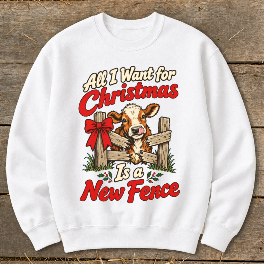 White sweatshirt with a Christmas cow graphic and text "All I Want for Christmas Is a New Fence."