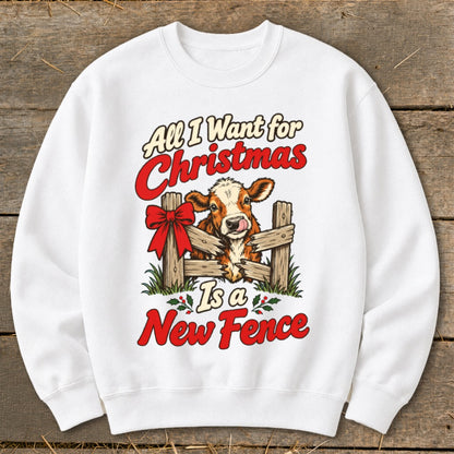 White sweatshirt with a Christmas cow graphic and text "All I Want for Christmas Is a New Fence."