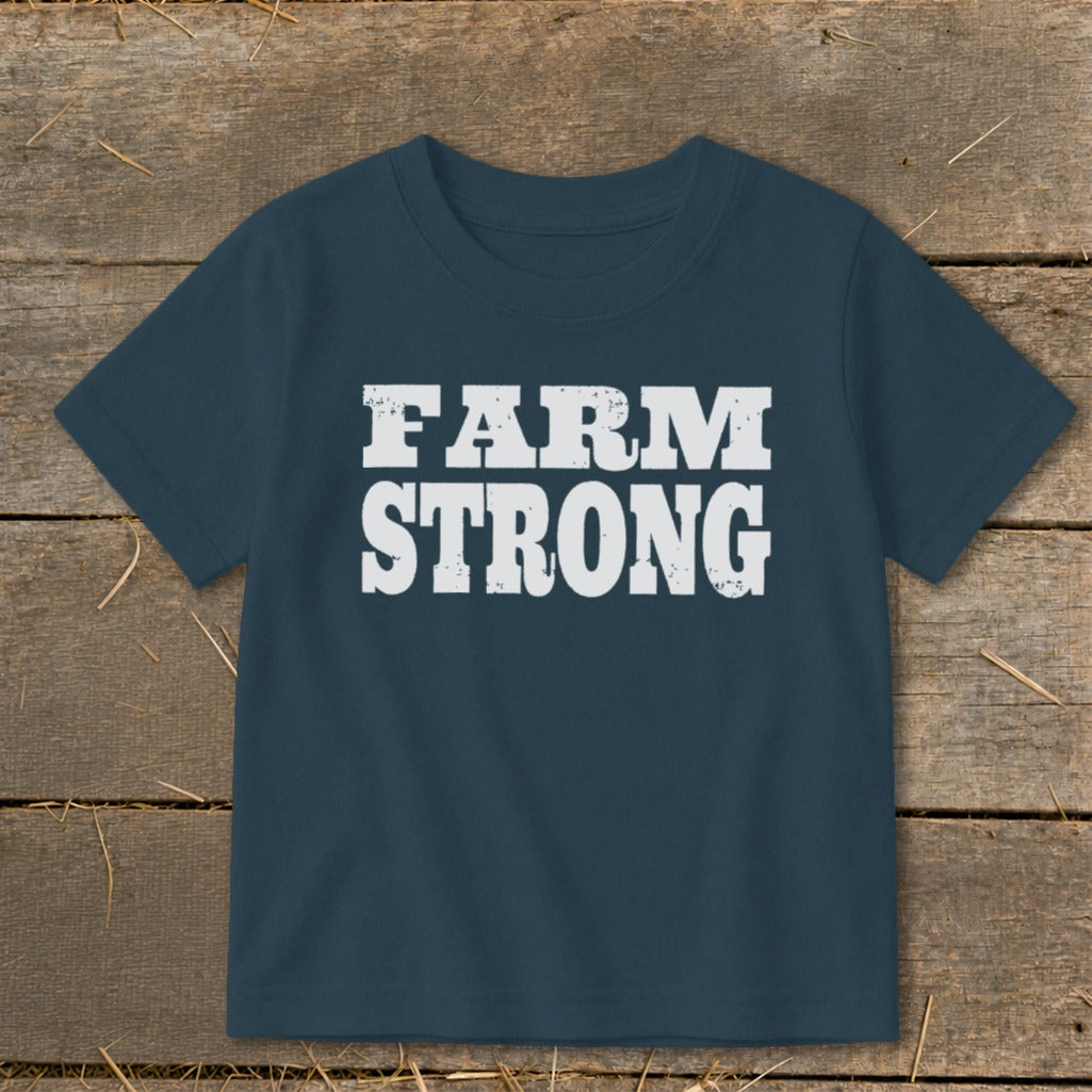 A dark blue short-sleeve children's t-shirt with the white distressed text "FARM STRONG" centered on the chest.