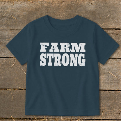 A dark blue short-sleeve children's t-shirt with the white distressed text "FARM STRONG" centered on the chest.