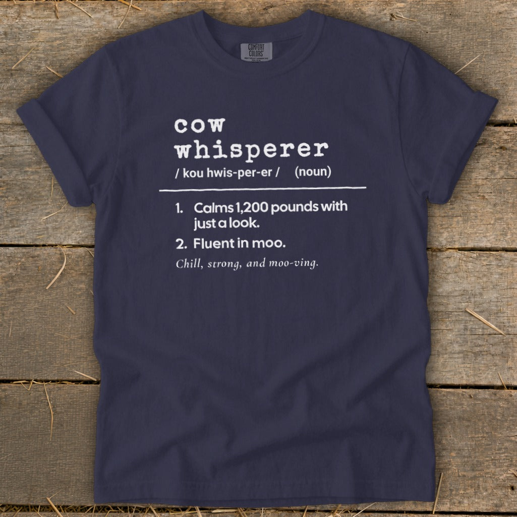 Navy t-shirt with "cow whisperer" definition printed in white text.