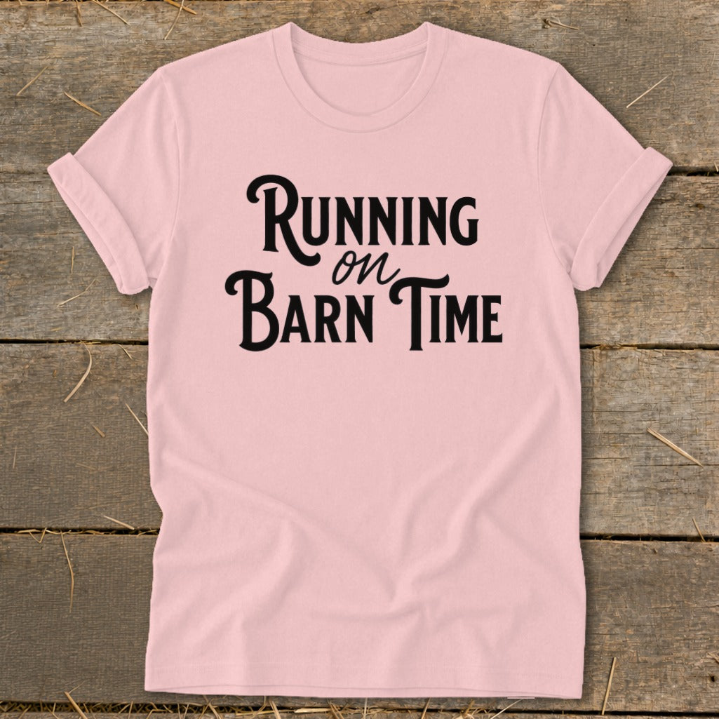 Pink t-shirt with black text reading "Running on Barn Time".