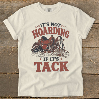Cream t-shirt with "It's not hoarding if it's tack" graphic and horse tack.
