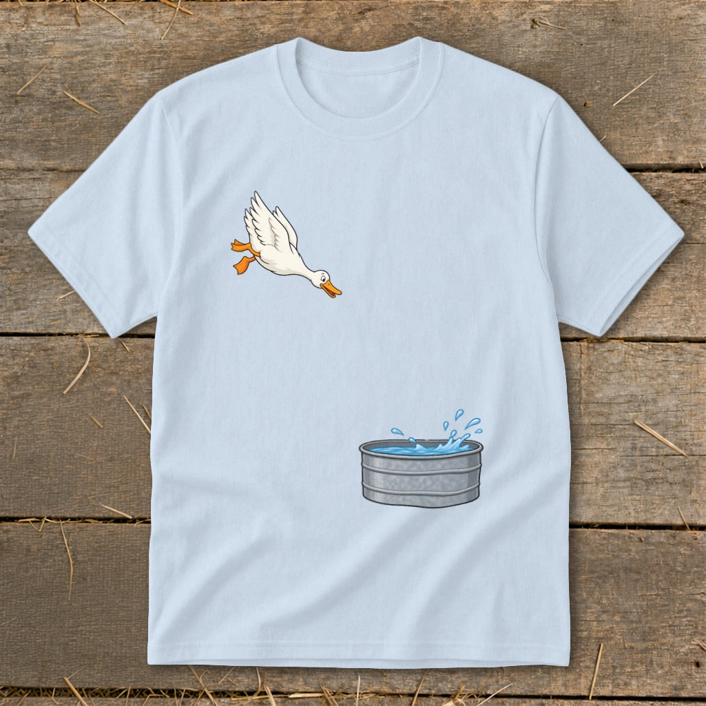 Light blue t-shirt with a cartoon duck jumping into a galvanized metal tub of water.