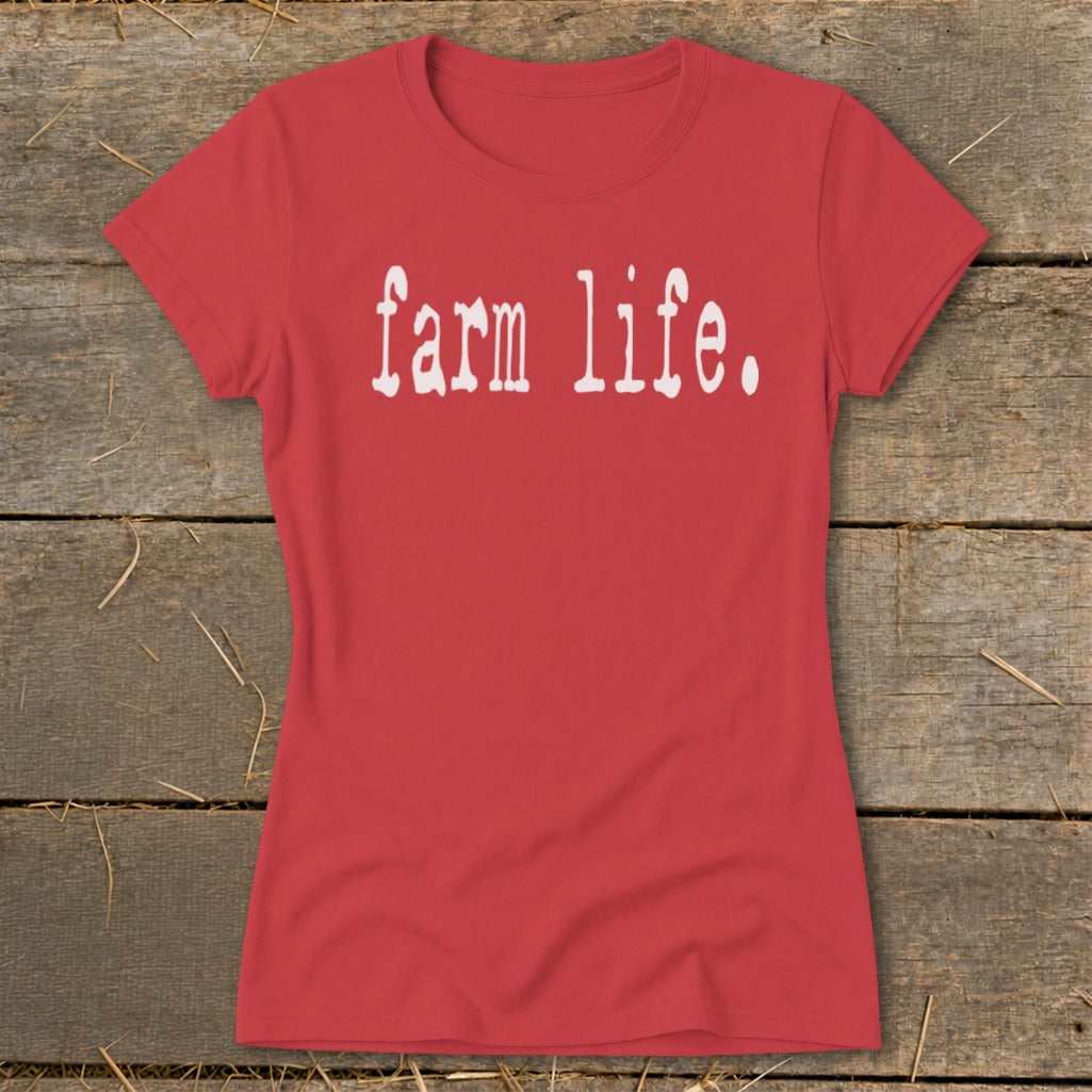 Red t-shirt with white "farm life." text on a wooden background.