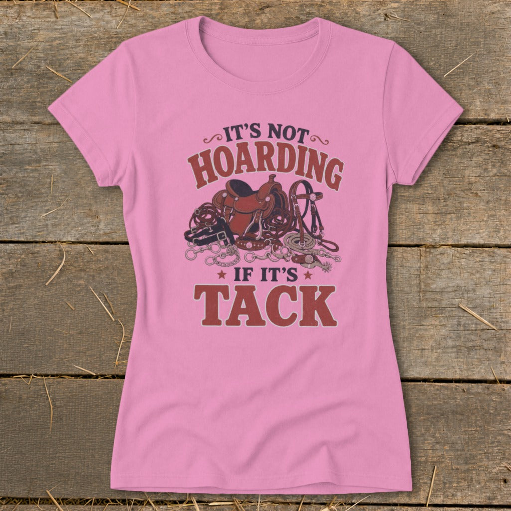 Pink t-shirt with "It's not hoarding if it's tack" and equestrian gear graphic.