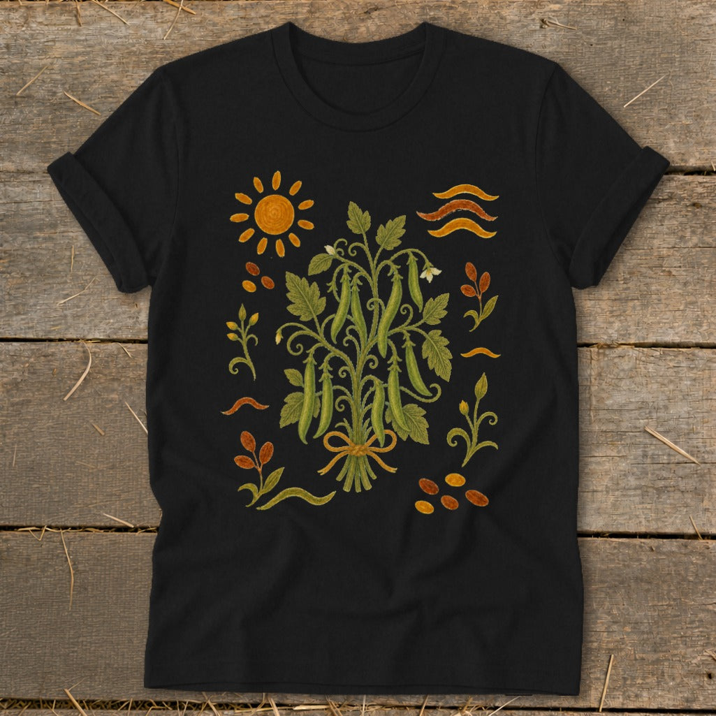 Black t-shirt with a botanical illustration of a pea plant, sun, and abstract motifs.
