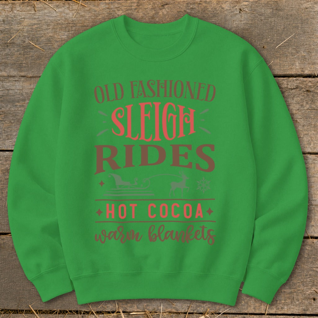 Green sweatshirt with "Old Fashioned Sleigh Rides," and "Hot Cocoa Warm Blankets" text.