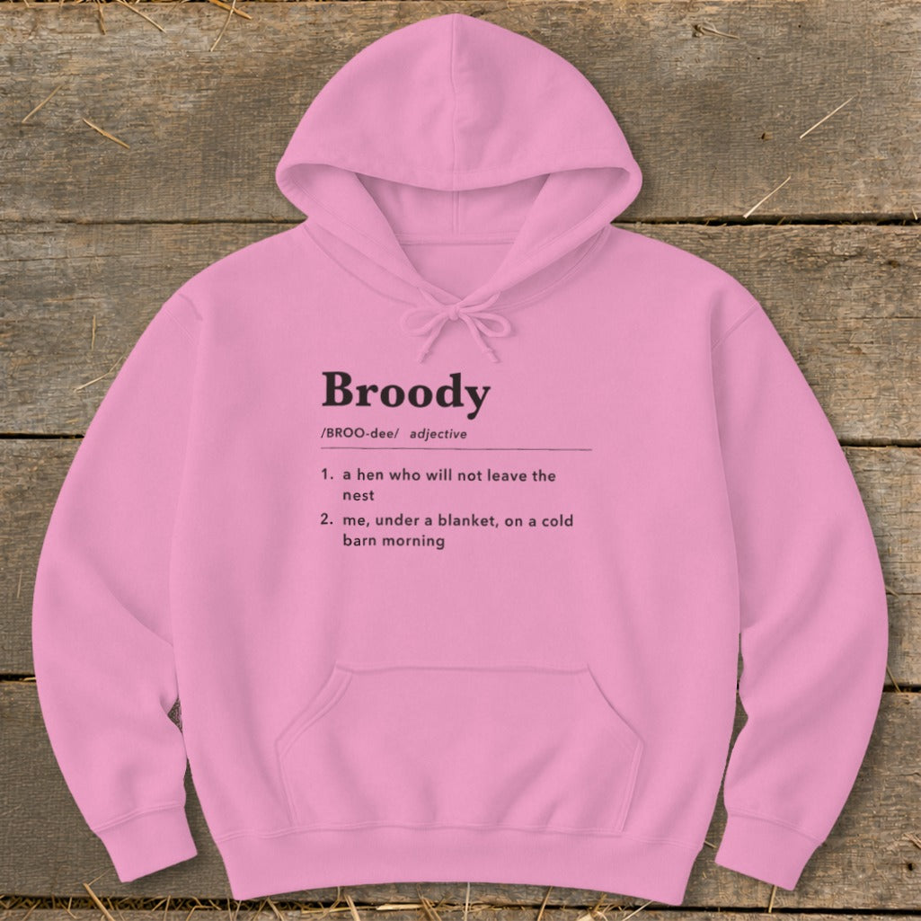 Pink hoodie with "Broody" definition: a hen who will not leave the nest, and me under a blanket.