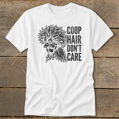 White t-shirt with a black graphic of a chicken and text reading "COOP HAIR DON'T CARE".