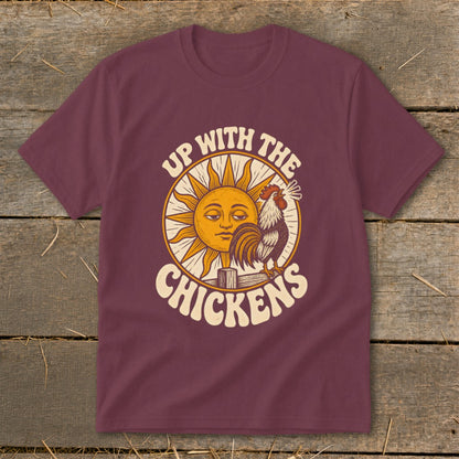 Maroon t-shirt featuring a retro graphic of a sun, a rooster, and the text Up With The Chickens.
