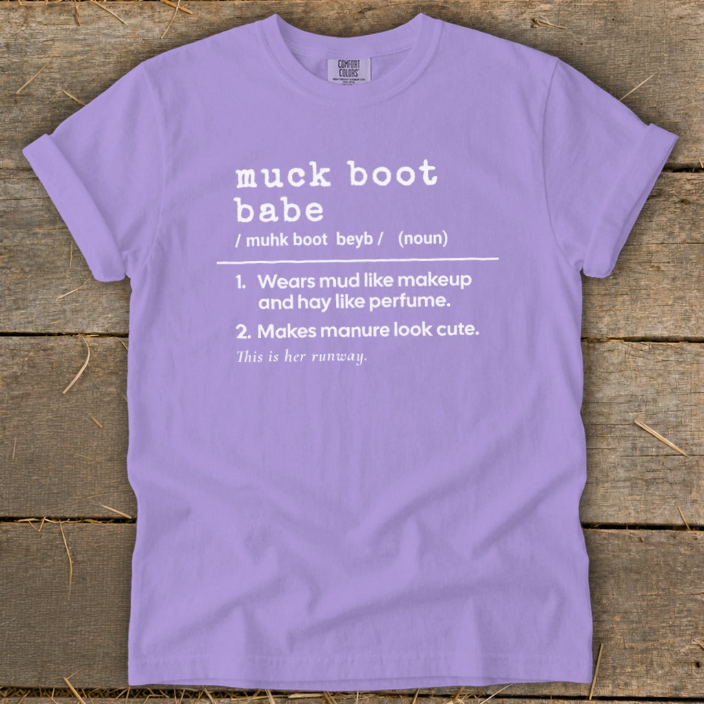 Lavender Comfort Colors t-shirt with "muck boot babe" definition printed in white.