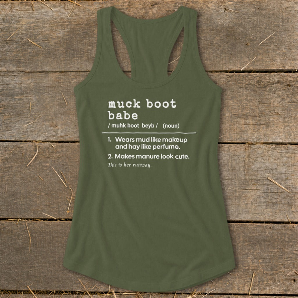 Green tank top with "muck boot babe" definition printed in white text.