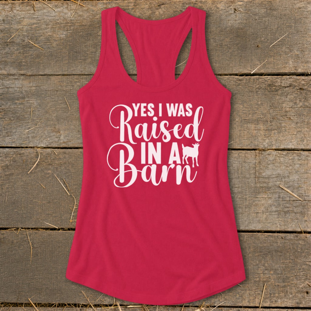 Pink tank top with white text "Yes I Was Raised In A Barn" and a goat silhouette.
