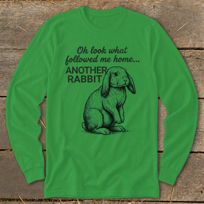 Green long-sleeve shirt with sketch of rabbit and text "Oh look what followed me home... ANOTHER RABBIT".